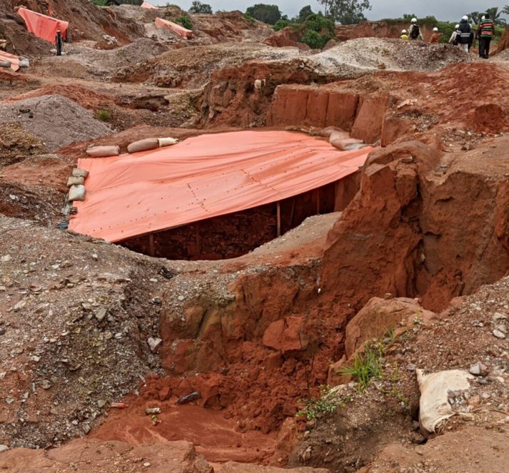 Mining site, with protective tent over a digging area