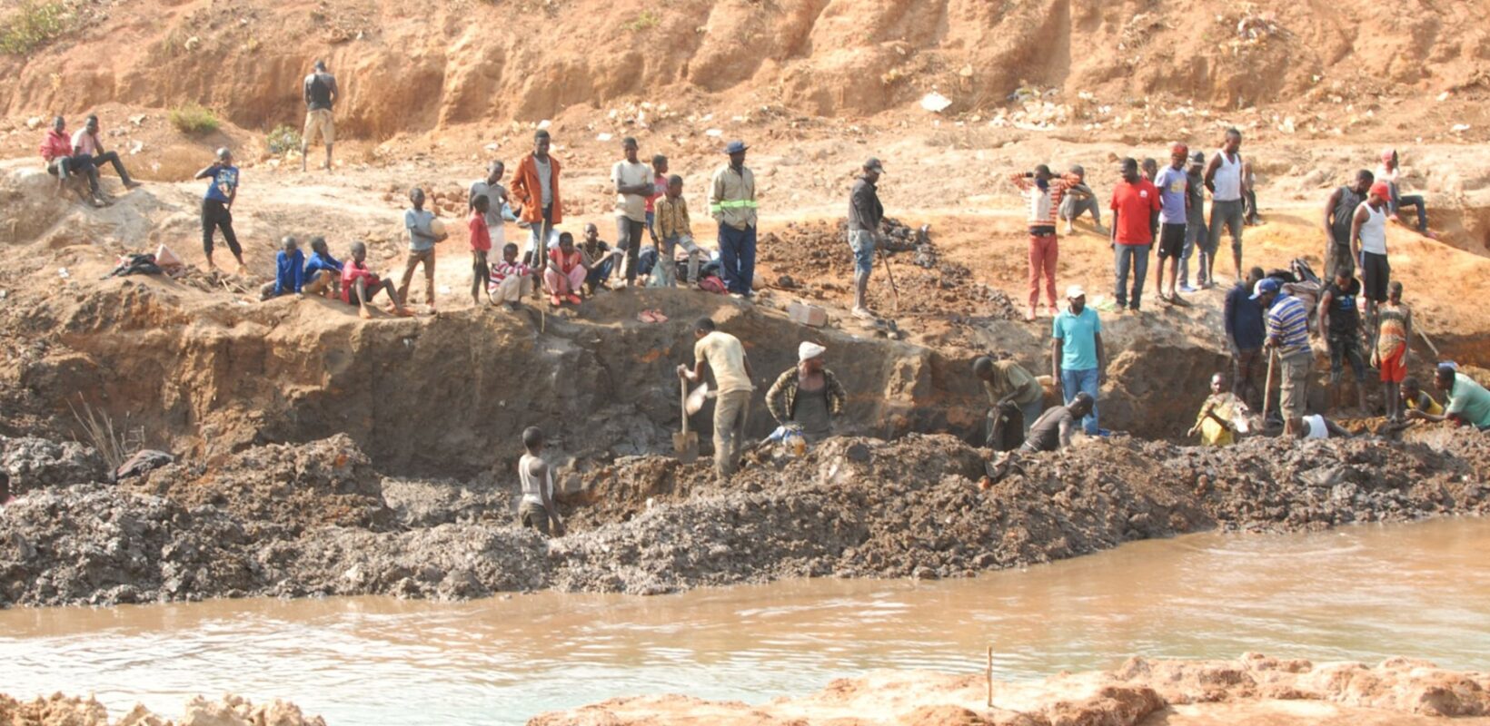 Children working on a riverbank