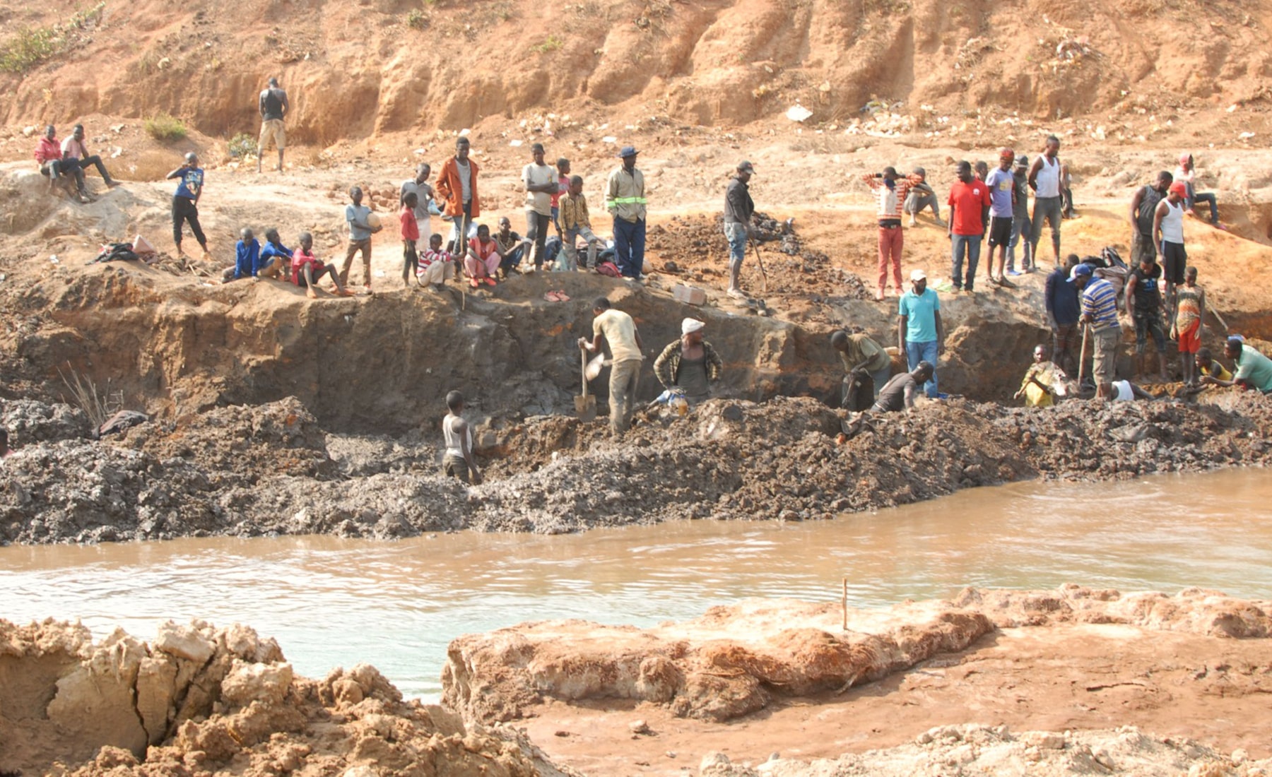 Children working on a riverbank