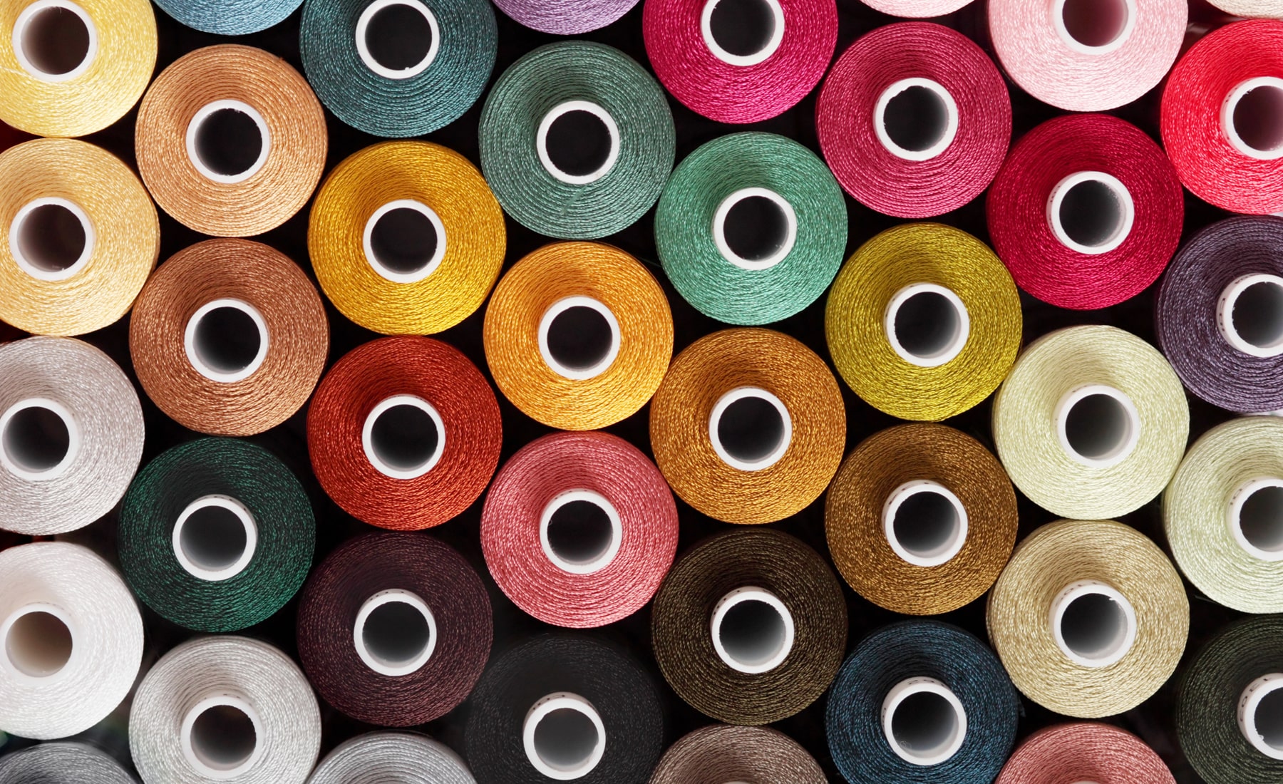 Close up of sewing threads, in different colours