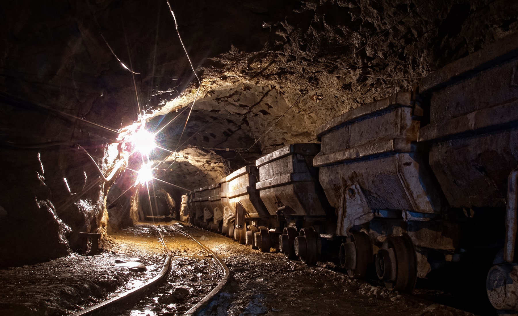 Mining carts on the track in an underground tunnel