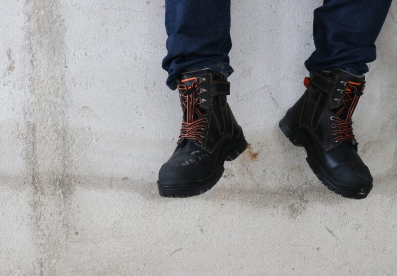A,Construction,Worker,Wears,Brown,Leather,Boots,